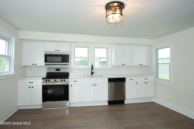 798 State Highway 29, Broadalbin, NY 12025 - kitchen featuring appliances with stainless steel finishes, backsplash, light countertops, and white cabinetry