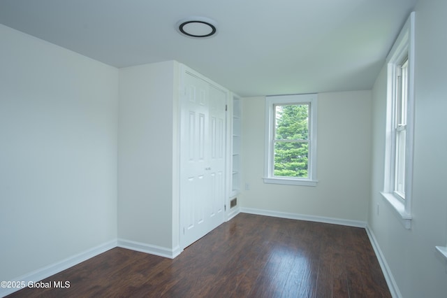 798 State Highway 29, Broadalbin, NY 12025 - unfurnished bedroom with dark wood-style flooring and a closet