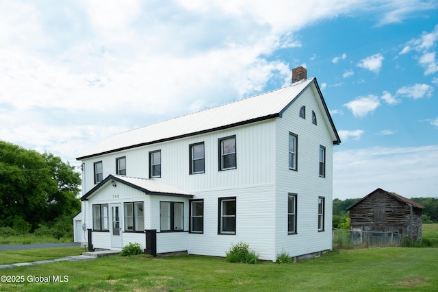 798 State Highway 29, Broadalbin, NY 12025 - modern farmhouse style home with a chimney, a front lawn, and a metal roof