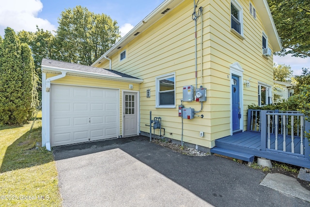 35 Magee Dr, Bethlehem, NY 12077 - view of property exterior with a garage, driveway, and cooling unit