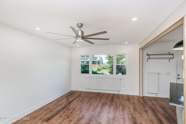 35 Magee Dr, Bethlehem, NY 12077 - empty room featuring radiator heating unit, wood finished floors, ceiling fan, and recessed lighting