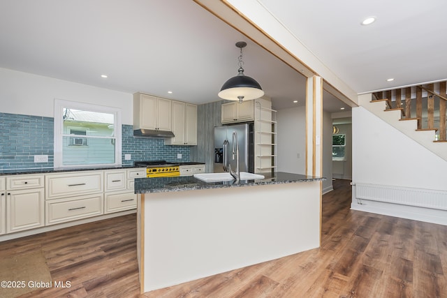 35 Magee Dr, Bethlehem, NY 12077 - kitchen featuring stainless steel refrigerator with ice dispenser, dark wood-style floors, dark stone counters, backsplash, and pendant lighting