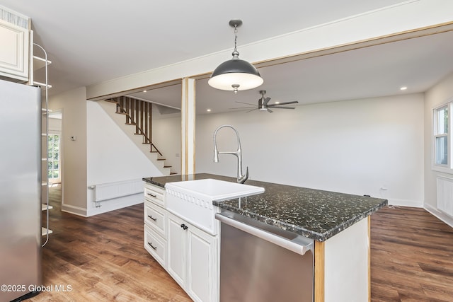 35 Magee Dr, Bethlehem, NY 12077 - kitchen with appliances with stainless steel finishes, dark wood finished floors, a ceiling fan, decorative light fixtures, and white cabinetry