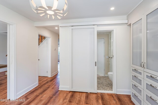 35 Magee Dr, Bethlehem, NY 12077 - unfurnished bedroom with wood finished floors, recessed lighting, connected bathroom, and a chandelier