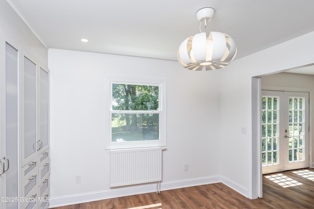 35 Magee Dr, Bethlehem, NY 12077 - unfurnished dining area with french doors, a chandelier, dark wood-type flooring, radiator heating unit, and recessed lighting