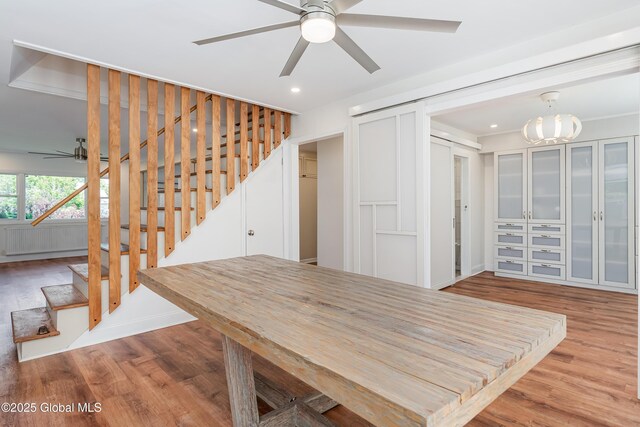 35 Magee Dr, Bethlehem, NY 12077 - unfurnished dining area featuring a ceiling fan, wood finished floors, stairway, recessed lighting, and a chandelier