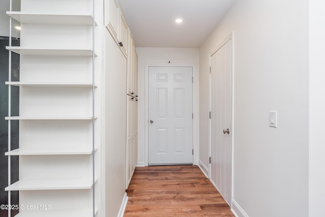 35 Magee Dr, Bethlehem, NY 12077 - corridor with light wood finished floors and recessed lighting