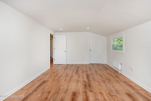 35 Magee Dr, Bethlehem, NY 12077 - unfurnished bedroom featuring light wood finished floors, vaulted ceiling, and recessed lighting