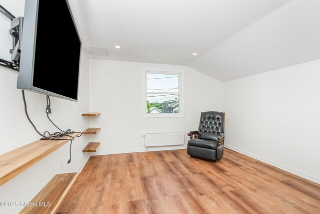 35 Magee Dr, Bethlehem, NY 12077 - unfurnished room with radiator, vaulted ceiling, light wood-style floors, and recessed lighting