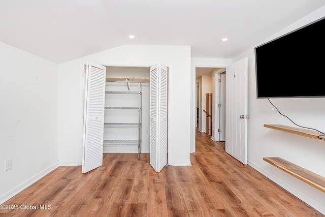 35 Magee Dr, Bethlehem, NY 12077 - unfurnished bedroom featuring light wood-type flooring, a closet, vaulted ceiling, and recessed lighting