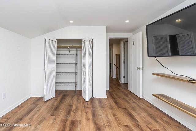 35 Magee Dr, Bethlehem, NY 12077 - unfurnished bedroom featuring wood finished floors, a closet, lofted ceiling, and recessed lighting