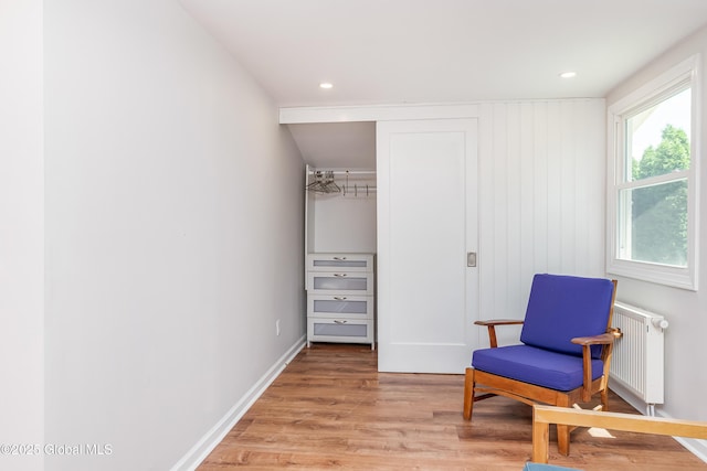 35 Magee Dr, Bethlehem, NY 12077 - sitting room featuring radiator heating unit and light wood-style flooring