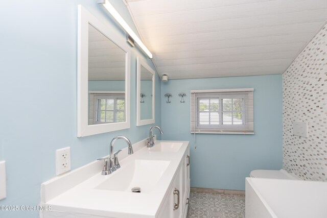 35 Magee Dr, Bethlehem, NY 12077 - full bathroom with vanity, a tub to relax in, tile patterned flooring, and lofted ceiling