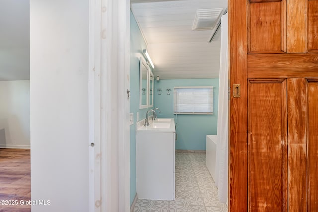 35 Magee Dr, Bethlehem, NY 12077 - bathroom with vanity and a tub to relax in