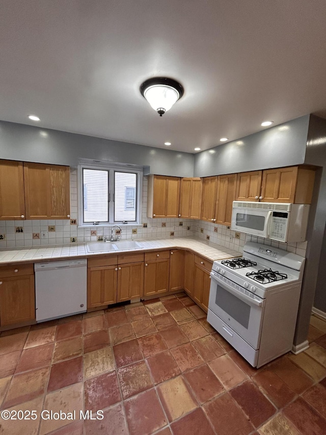 528 Harrison Ave, Schenectady, NY 12306 - kitchen featuring white appliances, tile countertops, tasteful backsplash, recessed lighting, and stone tile flooring