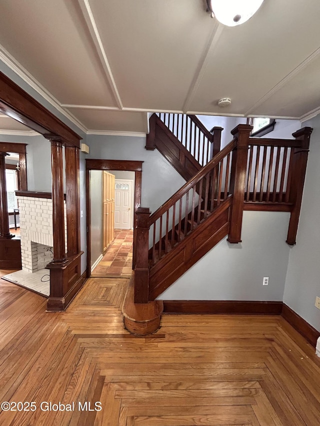 528 Harrison Ave, Schenectady, NY 12306 - stairs with baseboards and decorative columns