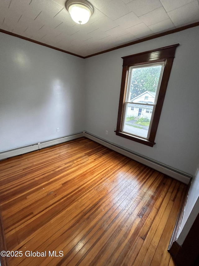 528 Harrison Ave, Schenectady, NY 12306 - spare room featuring crown molding and hardwood / wood-style flooring