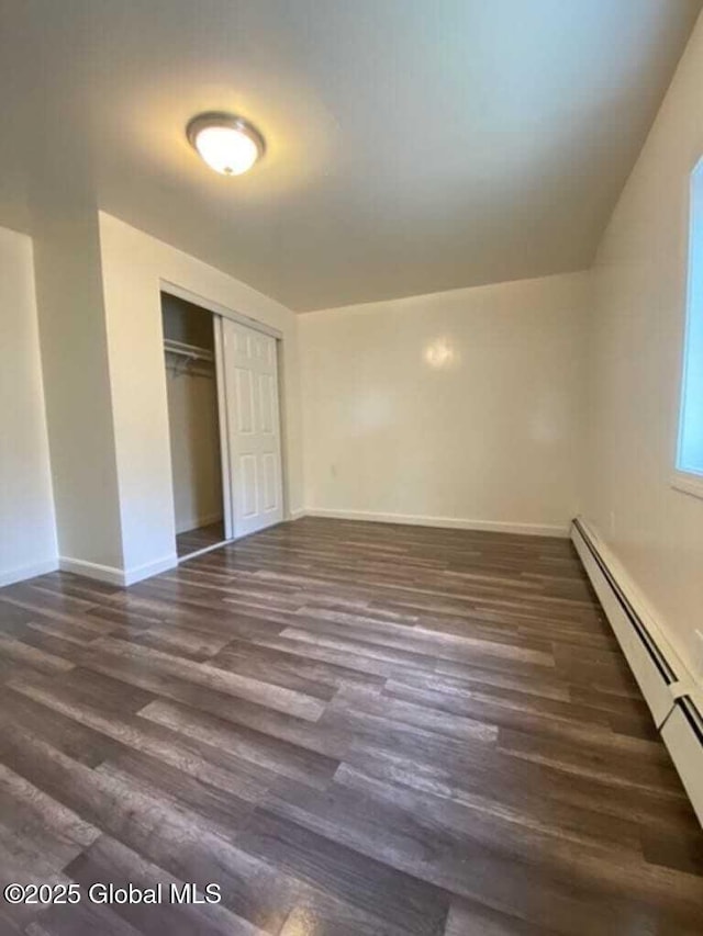 18 Railroad Ave, Berlin, NY 12022 - unfurnished bedroom with a baseboard radiator, wood finished floors, and a closet