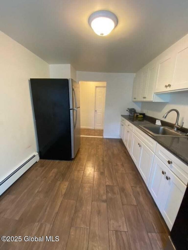 18 Railroad Ave, Berlin, NY 12022 - kitchen with freestanding refrigerator, dark countertops, dark wood finished floors, and white cabinets