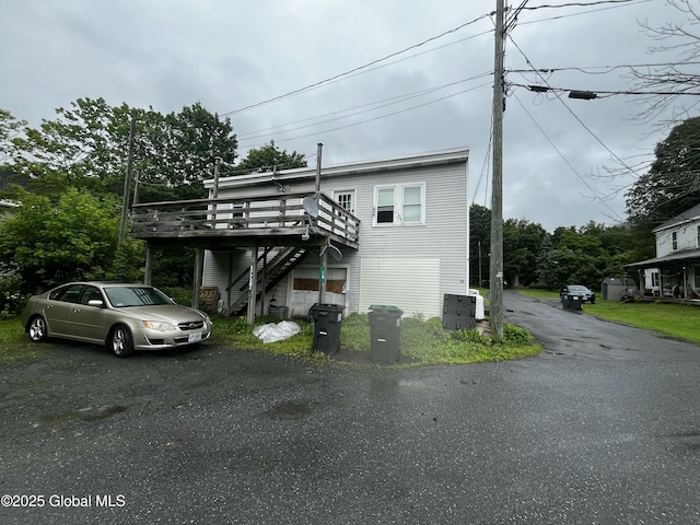18 Railroad Ave, Berlin, NY 12022 - view of front of home featuring stairway, a wooden deck, and asphalt driveway