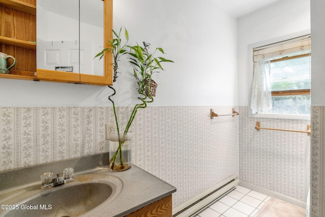 143 Main St, Maryland, NY 12155 - bathroom with a baseboard radiator, a wainscoted wall, vanity, and tile patterned flooring