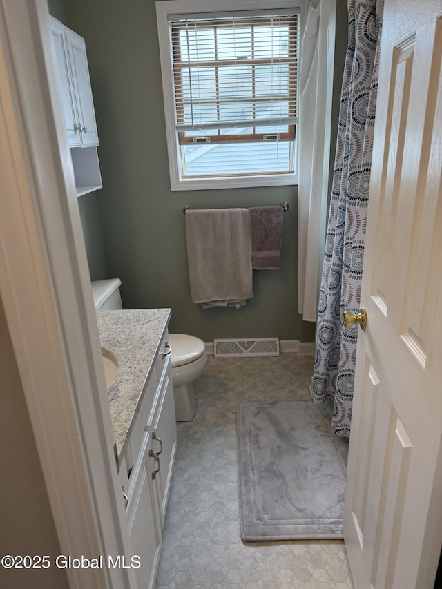 7048 Suzanne Ln, Guilderland, NY 12303 - full bath with vanity, tile patterned floors, and curtained shower