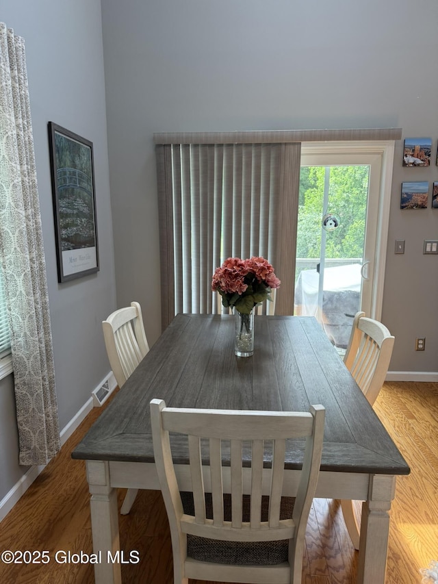 7048 Suzanne Ln, Guilderland, NY 12303 - dining space featuring baseboards and wood finished floors