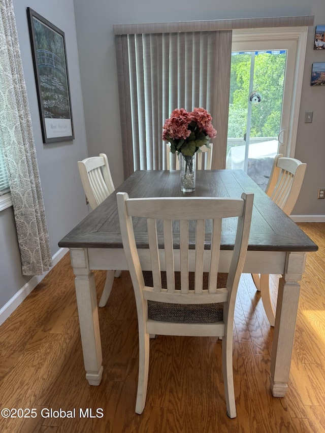 7048 Suzanne Ln, Guilderland, NY 12303 - dining space featuring baseboards and wood finished floors