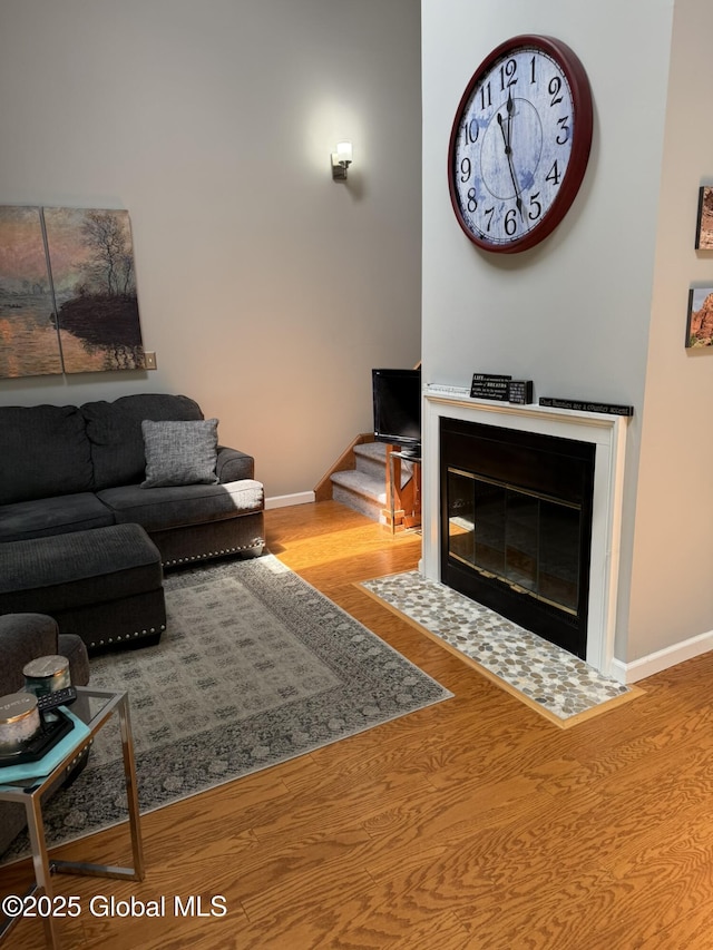 7048 Suzanne Ln, Guilderland, NY 12303 - living room with baseboards and wood finished floors