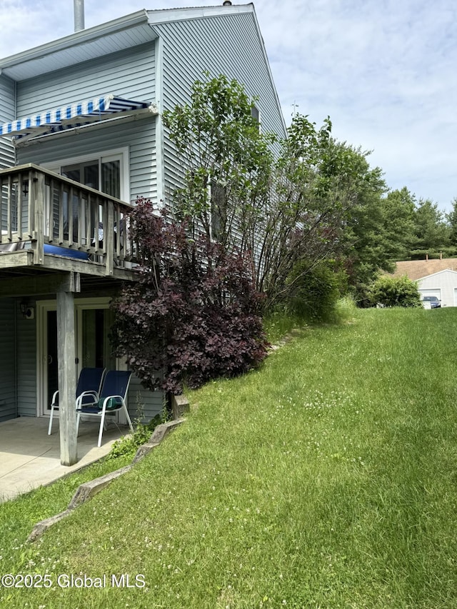 7048 Suzanne Ln, Guilderland, NY 12303 - view of grassy yard with a patio area and a wooden deck