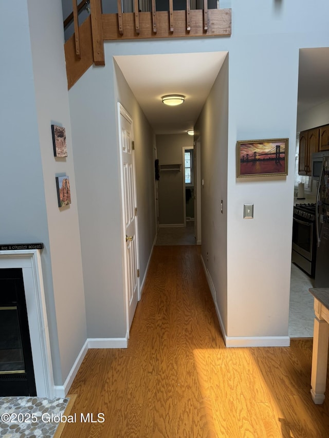7048 Suzanne Ln, Guilderland, NY 12303 - hallway featuring light wood-style floors and baseboards