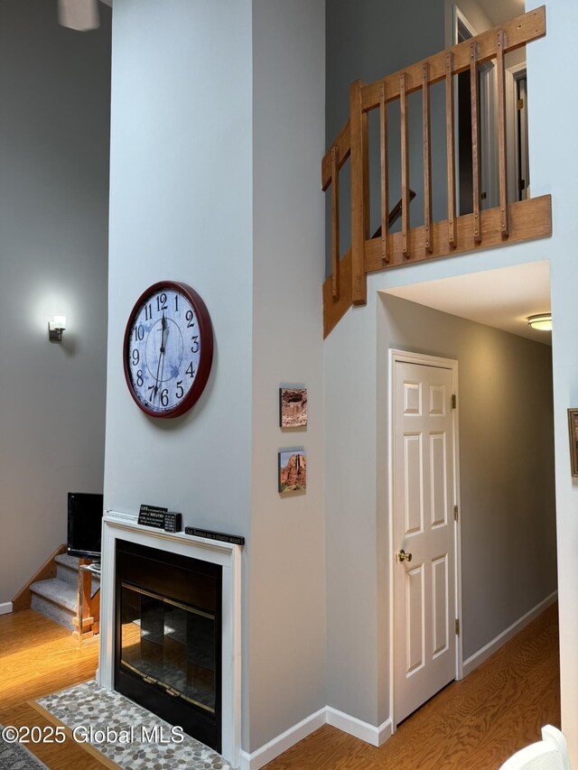7048 Suzanne Ln, Guilderland, NY 12303 - stairs featuring wood finished floors and baseboards