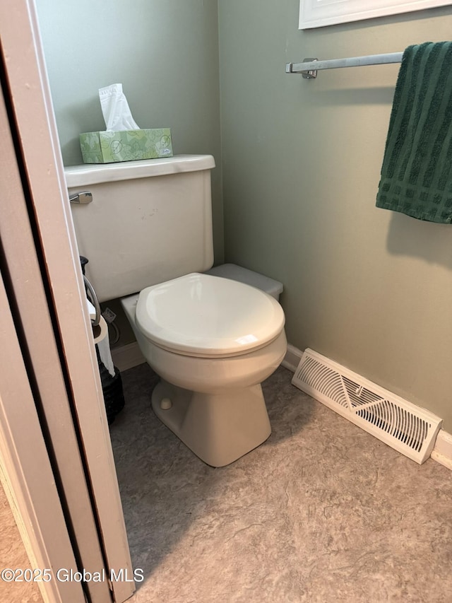 7048 Suzanne Ln, Guilderland, NY 12303 - bathroom with toilet and baseboards