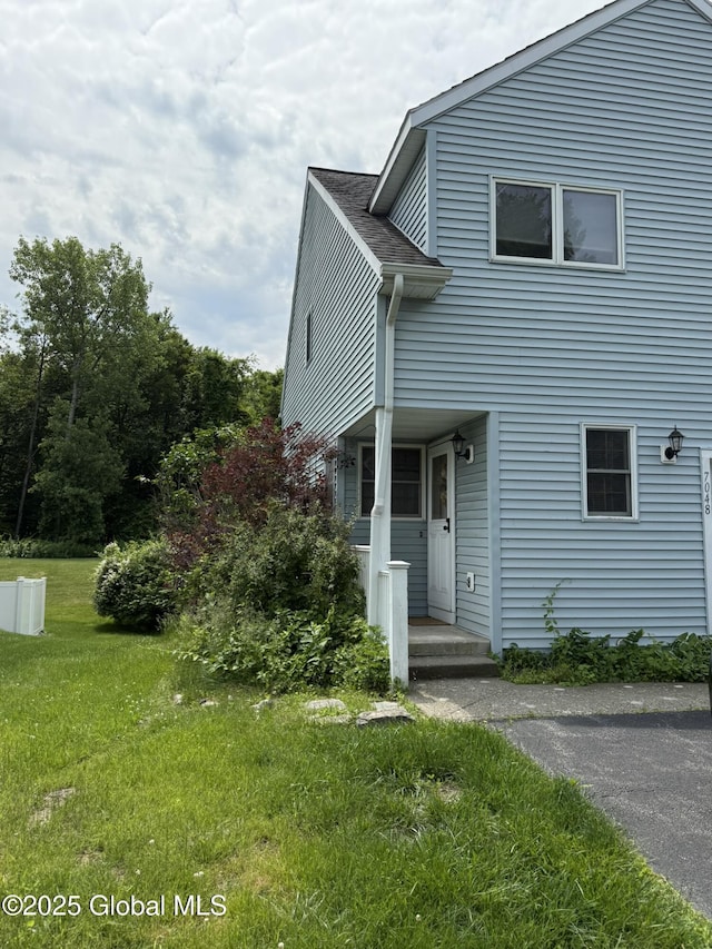 7048 Suzanne Ln, Guilderland, NY 12303 - view of front facade with a front lawn