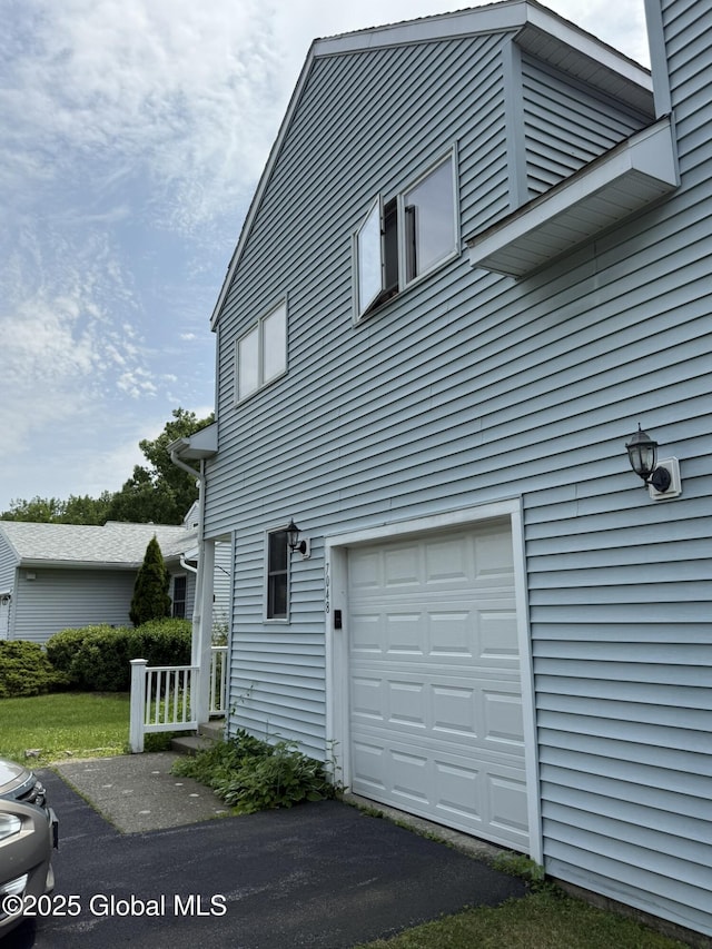 7048 Suzanne Ln, Guilderland, NY 12303 - view of side of property featuring a garage