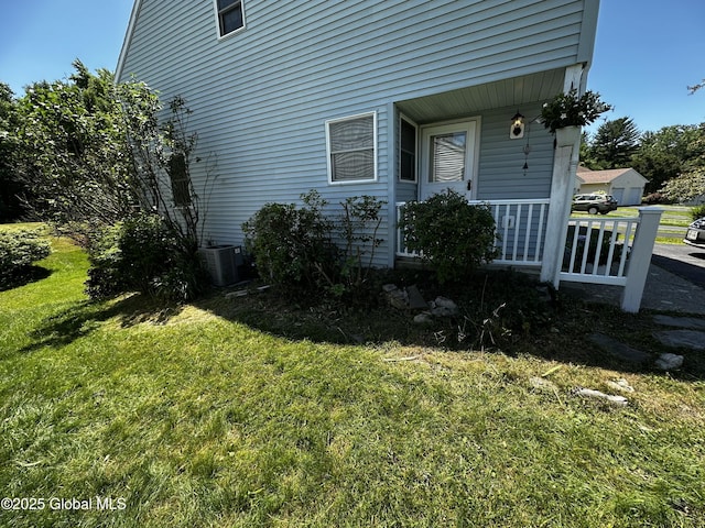 7048 Suzanne Ln, Guilderland, NY 12303 - view of property exterior featuring a lawn