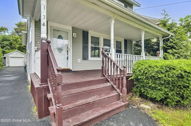 134 Whitehall Rd, Albany, NY 12209 - entrance to property with covered porch, driveway, and a garage