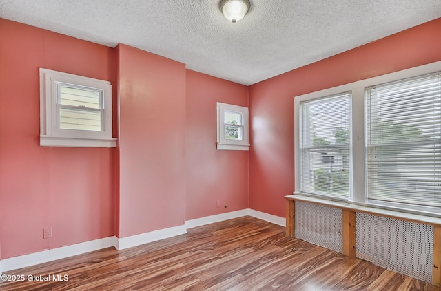 134 Whitehall Rd, Albany, NY 12209 - unfurnished room with wood finished floors and a textured ceiling