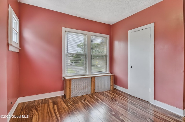 134 Whitehall Rd, Albany, NY 12209 - empty room featuring wood finished floors and a textured ceiling