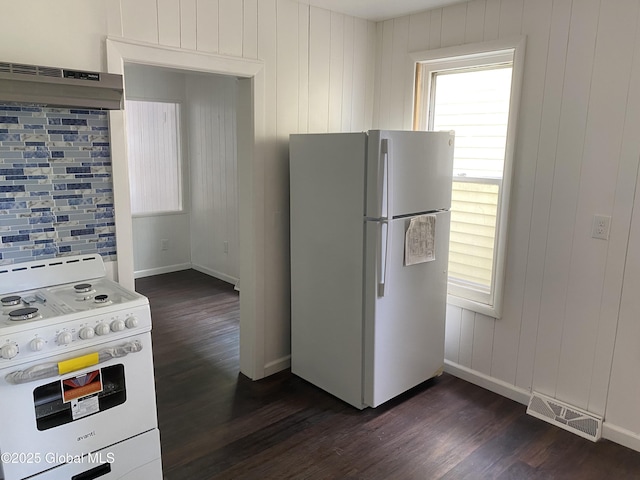 629 Lang St, Schenectady, NY 12308 - kitchen with white appliances, dark wood-style floors, tasteful backsplash, and under cabinet range hood