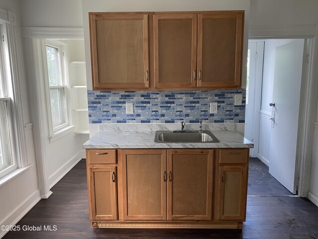 629 Lang St, Schenectady, NY 12308 - kitchen featuring dark wood-style floors, decorative backsplash, and light stone countertops