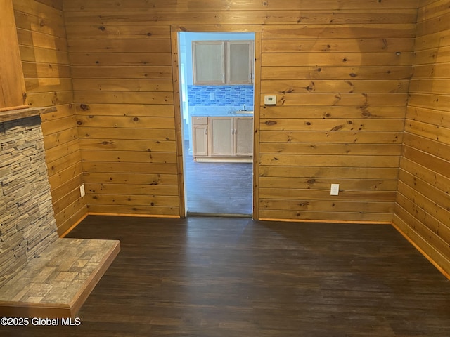 629 Lang St, Schenectady, NY 12308 - spare room with dark wood-style flooring and wood walls