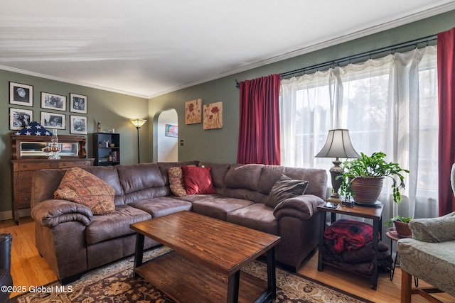 2305 Balltown Rd, Niskayuna, NY 12309 - living room featuring wood finished floors, arched walkways, and ornamental molding