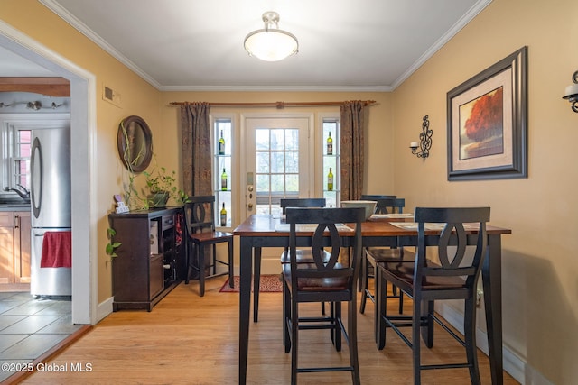 2305 Balltown Rd, Niskayuna, NY 12309 - dining room with ornamental molding and light wood-type flooring