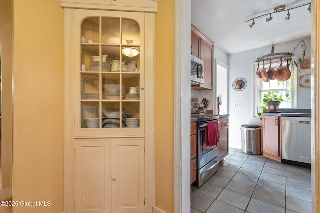 2305 Balltown Rd, Niskayuna, NY 12309 - kitchen featuring appliances with stainless steel finishes and light tile patterned floors