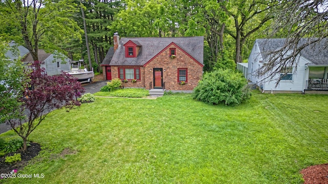 2305 Balltown Rd, Niskayuna, NY 12309 - view of front facade featuring brick siding, a chimney, and a front lawn
