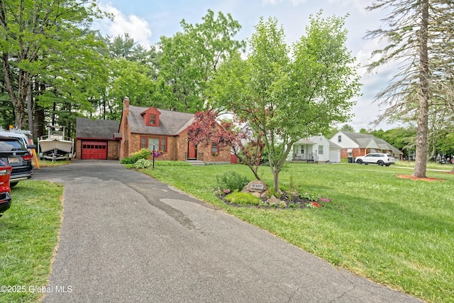 2305 Balltown Rd, Niskayuna, NY 12309 - view of front of property featuring brick siding, an attached garage, a front lawn, a chimney, and driveway