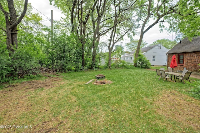 2305 Balltown Rd, Niskayuna, NY 12309 - view of grassy yard featuring a fire pit