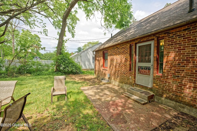 2305 Balltown Rd, Niskayuna, NY 12309 - view of grassy yard with entry steps and a patio area