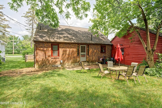 2305 Balltown Rd, Niskayuna, NY 12309 - back of house featuring a shingled roof, a yard, and brick siding